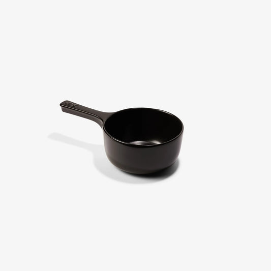 Xtrema black pure ceramic small saucepan with handle on a white background