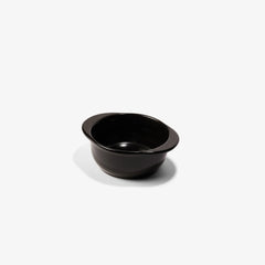 A sleek, black Xtrema pure ceramic dipping bowl isolated on a white background.