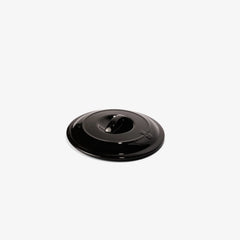 Glossy black Xtrema ceramic cookware lid with a centered handle on a white background.