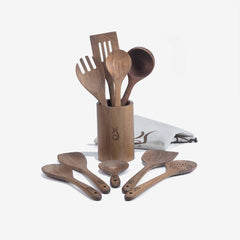 Xtrema professional wooden kitchen utensil set in a matching holder with a gray cloth.