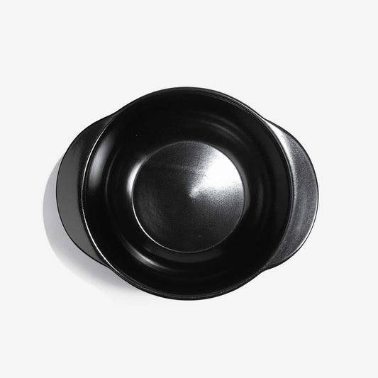 Top-down view of a black Xtrema pure ceramic cookware pot with handles.