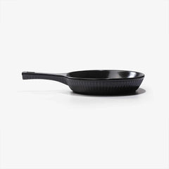 A professional black Xtrema pure ceramic frying pan on a white background.