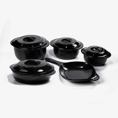 Set of black Xtrema pure ceramic cookware including pots with lids and a frying pan.
