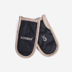 A pair of black and tan Xtrema ceramic cookware oven mitts on a white background.