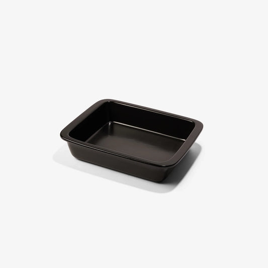 Professional black Xtrema pure ceramic rectangular baking dish isolated on a white background.
