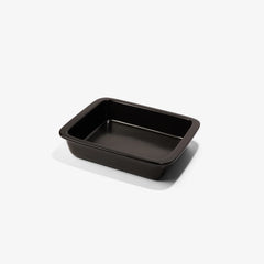 Professional black Xtrema pure ceramic rectangular baking dish isolated on a white background.