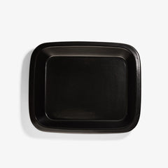 Top view of a sleek, black Xtrema pure ceramic rectangular baking dish on a white background.