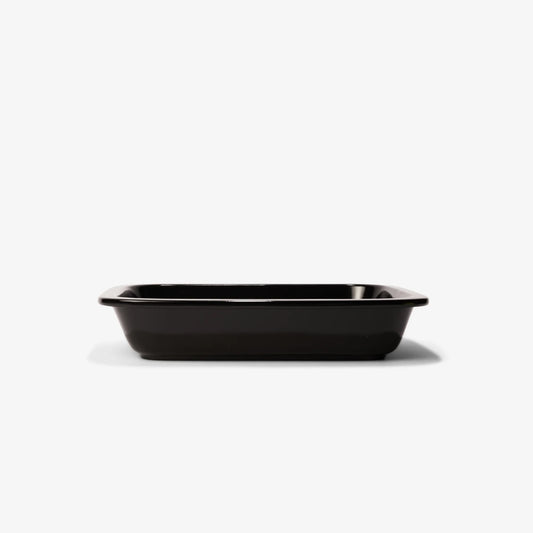A professional black Xtrema pure ceramic rectangular baking dish against a white background.