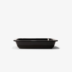 A professional black Xtrema pure ceramic rectangular baking dish against a white background.