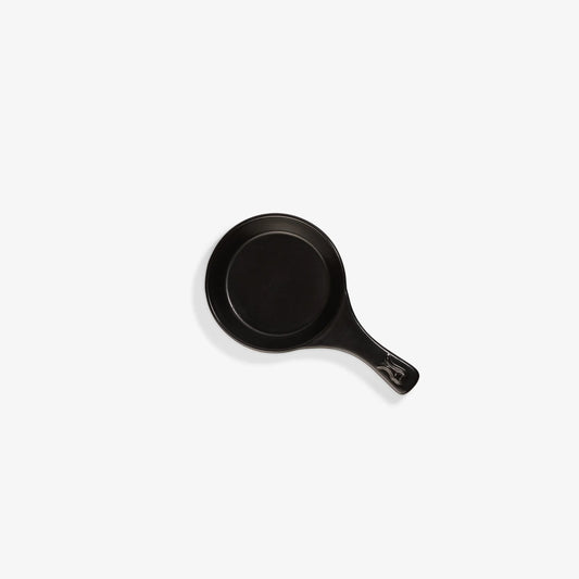 Top-down view of a sleek black Xtrema pure ceramic frying pan on a white background.