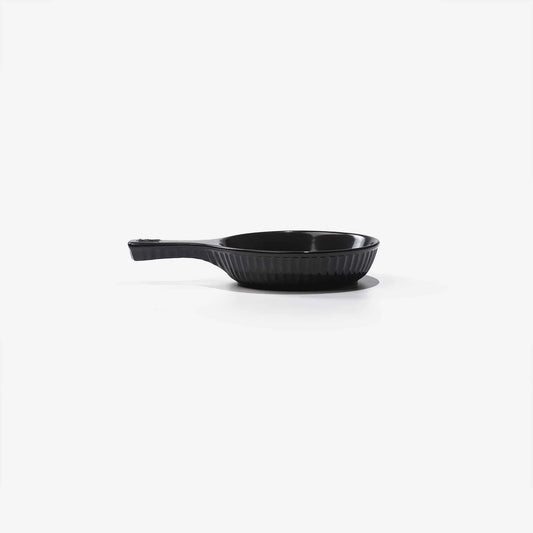 Xtrema black pure ceramic skillet with a ribbed interior and ergonomic handle.