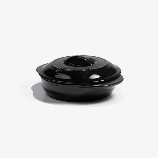 Glossy black Xtrema pure ceramic casserole dish with lid on a white background.