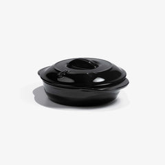 Glossy black Xtrema pure ceramic casserole dish with lid on a white background.