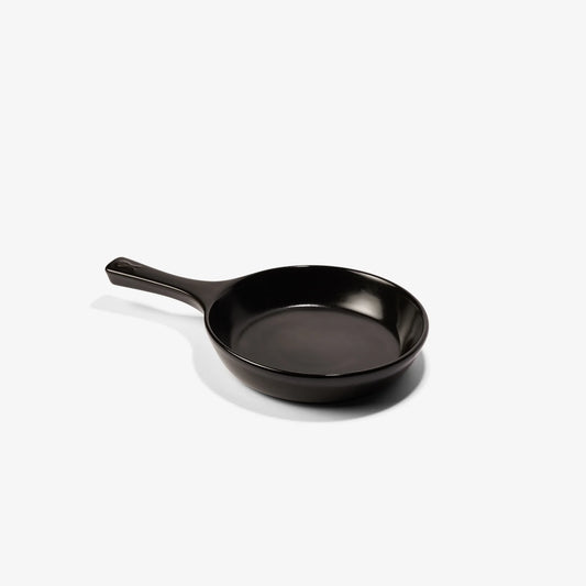 A sleek, black Xtrema pure ceramic frying pan isolated on a white background.