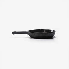 Xtrema black pure ceramic frying pan with a textured interior and long handle.