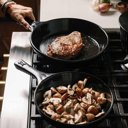Searing steak and sautéing mushrooms in Xtrema pure ceramic skillets on a gas stove.