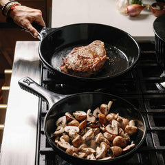 Searing steak and sautéing mushrooms in Xtrema pure ceramic skillets on a gas stove.