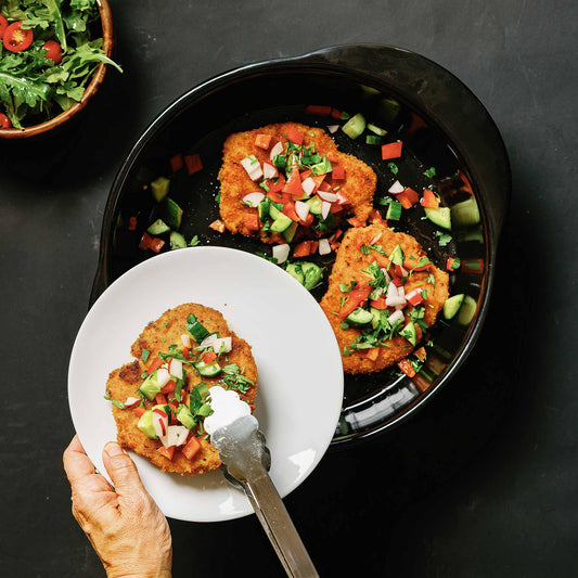 Gourmet patties with fresh salsa served in an Xtrema ceramic skillet.