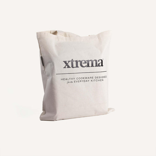 White Xtrema brand canvas tote bag with healthy cookware branding.