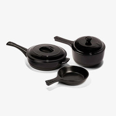 Set of black Xtrema pure ceramic cookware including a saucepan, skillet, and pot with lids.