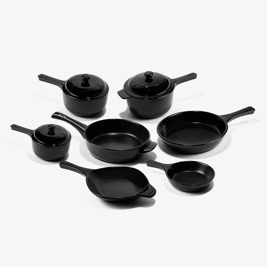 Set of professional Xtrema black ceramic cookware including pots, pans, and lids.