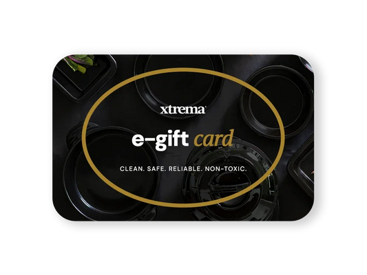 Xtrema e-gift card featuring black pure ceramic cookware on a dark background.