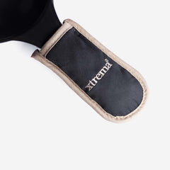 Close-up of a black Xtrema heat-resistant handle protector with a beige trim.