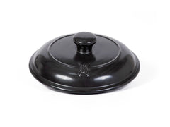 Xtrema black pure ceramic cookware lid with knob on a white background
