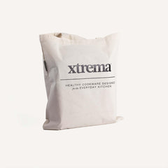 Off-white Xtrema branded tote bag with healthy cookware text on a white background